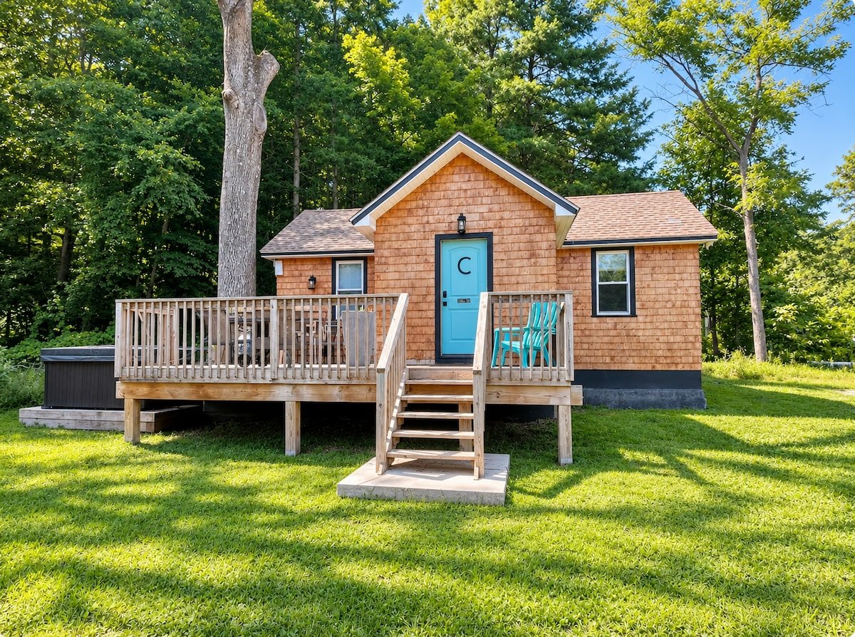 Cove tiny home exterior with blue door in Ellenville, New York